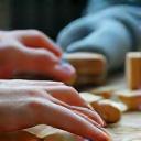 Person doing a puzzle, symbolizing mental agility and brain health