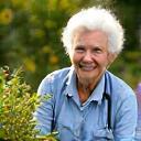 Elderly person gardening with vigor, symbolizing active longevity